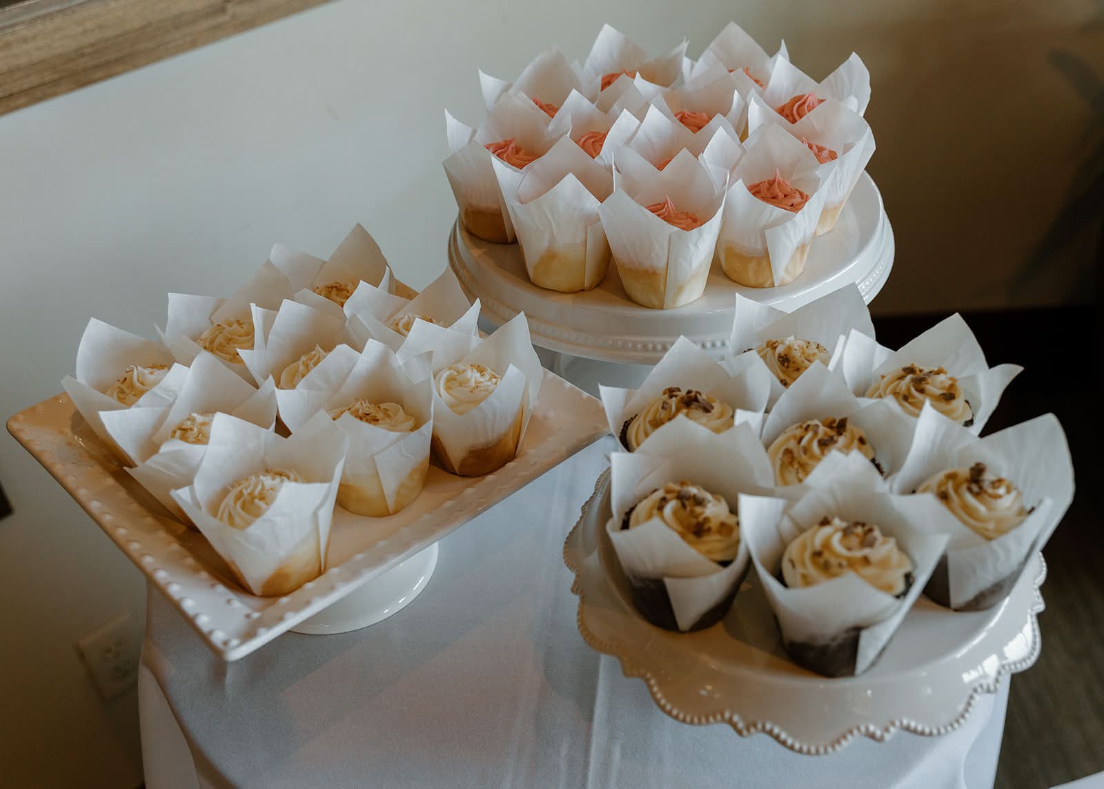 Cupcake display with multiple flavors on tiered stands